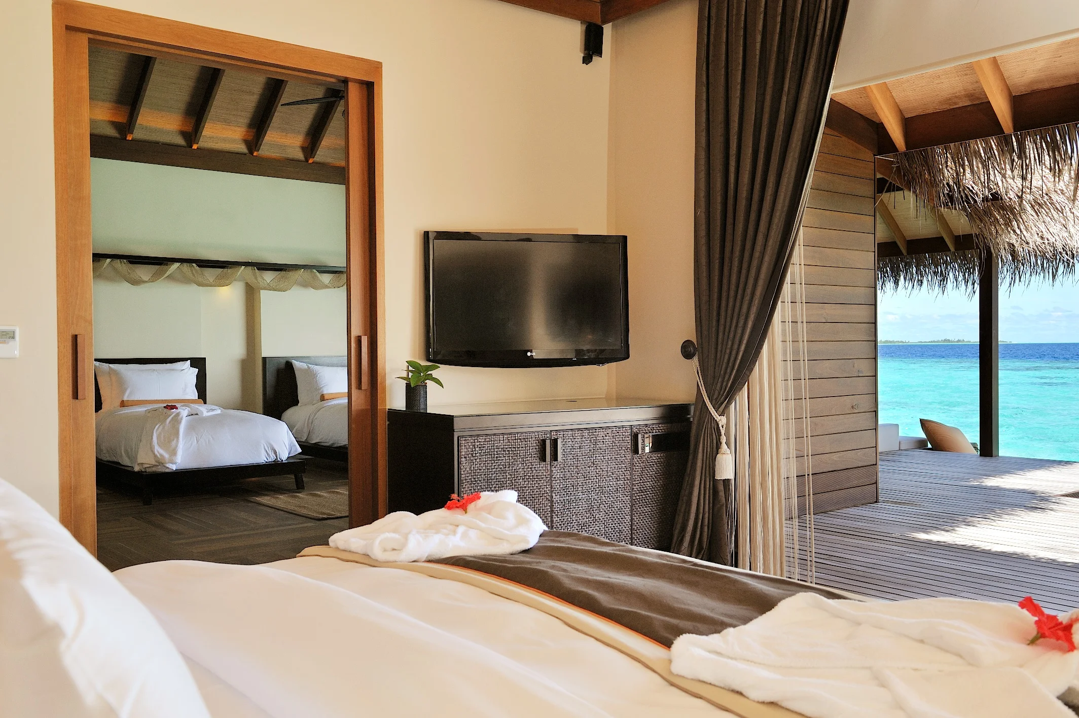 Sunset Family Ocean Suite with Pool · Two bedrooms · over-water sunset